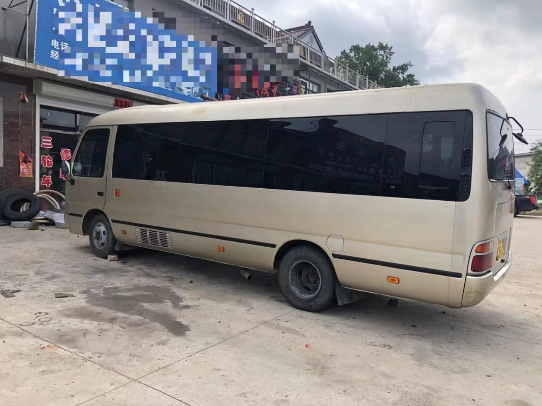 Toyota Mini Used Coaster Bus With ha lasciato a porta del passeggero 23 sedili 1Hz motore diesel