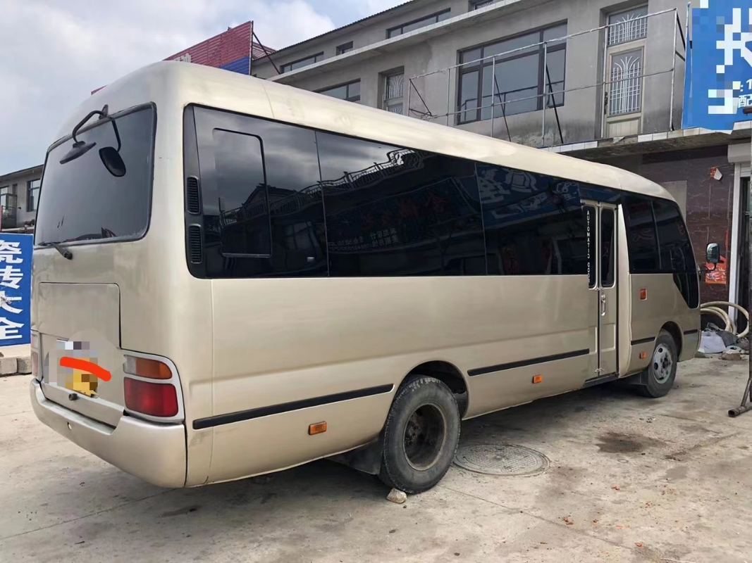 Toyota Mini Used Coaster Bus With ha lasciato a porta del passeggero 23 sedili 1Hz motore diesel
